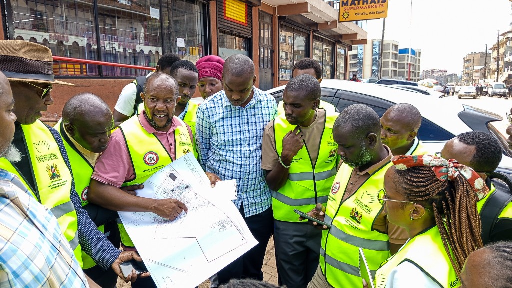 Team reviewing the Umoja settlement plan on site in Mathare, Kajiado County